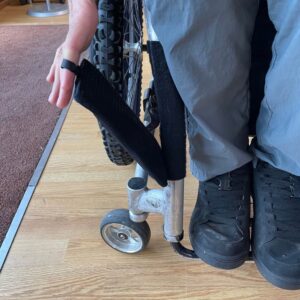 You can use the loops to remove the handy pouch from your wheelchair