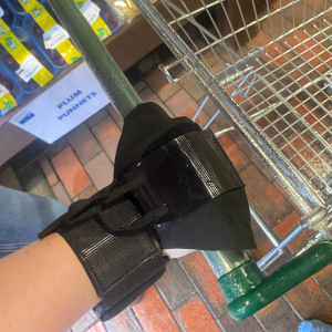 Lite aid gripping aid on hand holding on to shopping trolley