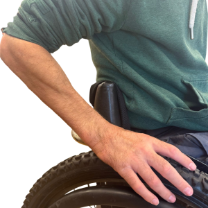 Sleeve holder with sleeve pulled up being used by Rob, a wheelchair user