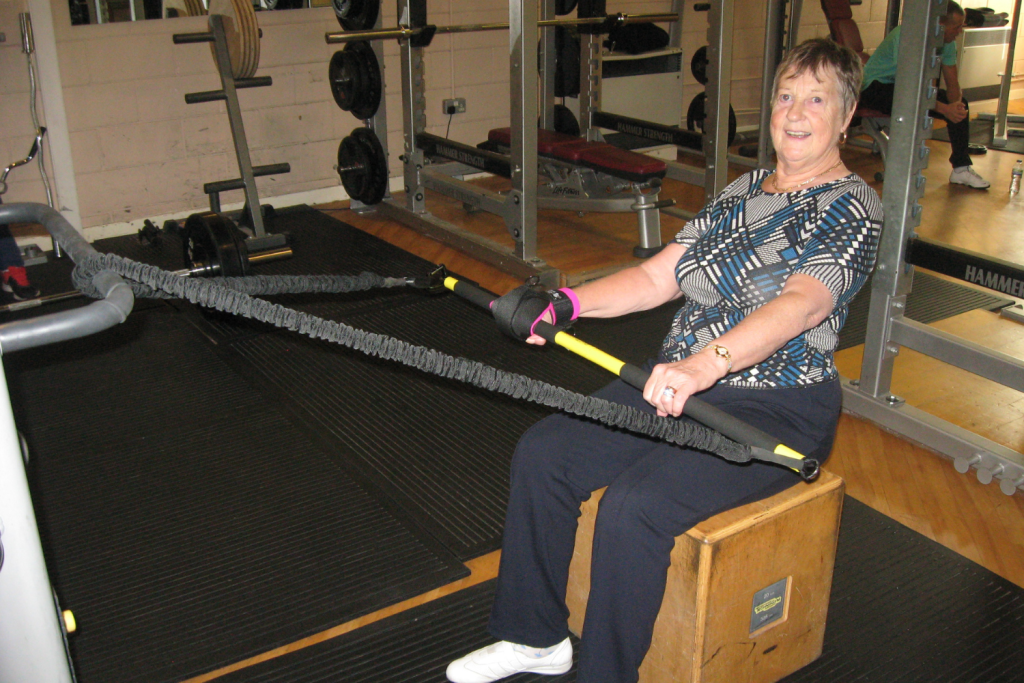 Irene, who is a stroke survivor exercises using her Active Hands General Purpose aid