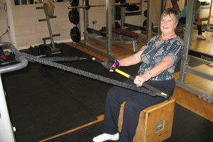 Irene, who is a stroke survivor exercises using her Active Hands General Purpose aid