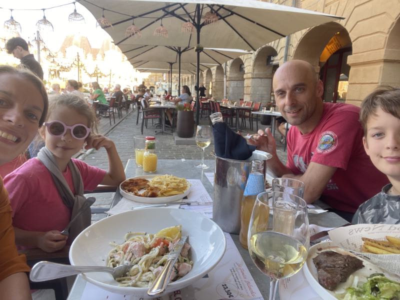 Rob, Jo and their children having a meal out on their holiday