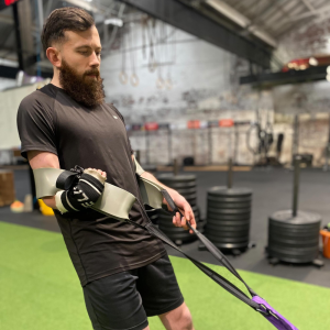 Harry who is an athlete with a limb difference uses the Gecko band to do a sled pull