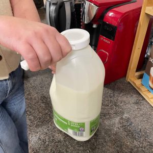 The Cap Off adjusts to different sized lids - like this milk bottle