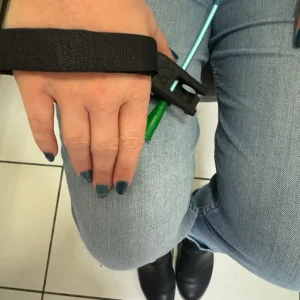 Right-hand Catheter Tool on a knee showing how you can hold it to insert a catheter