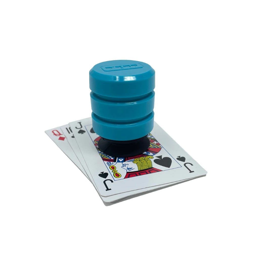A teal coloured P'KUP device that helps you to pick up playing cards